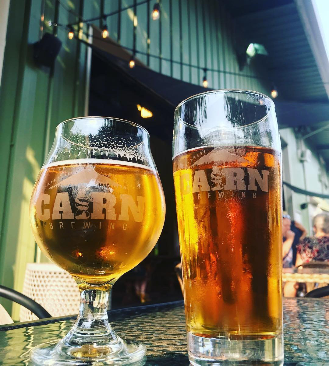 Glasses of beer on a table outside of Carin Brewing near Bothell, Washington.