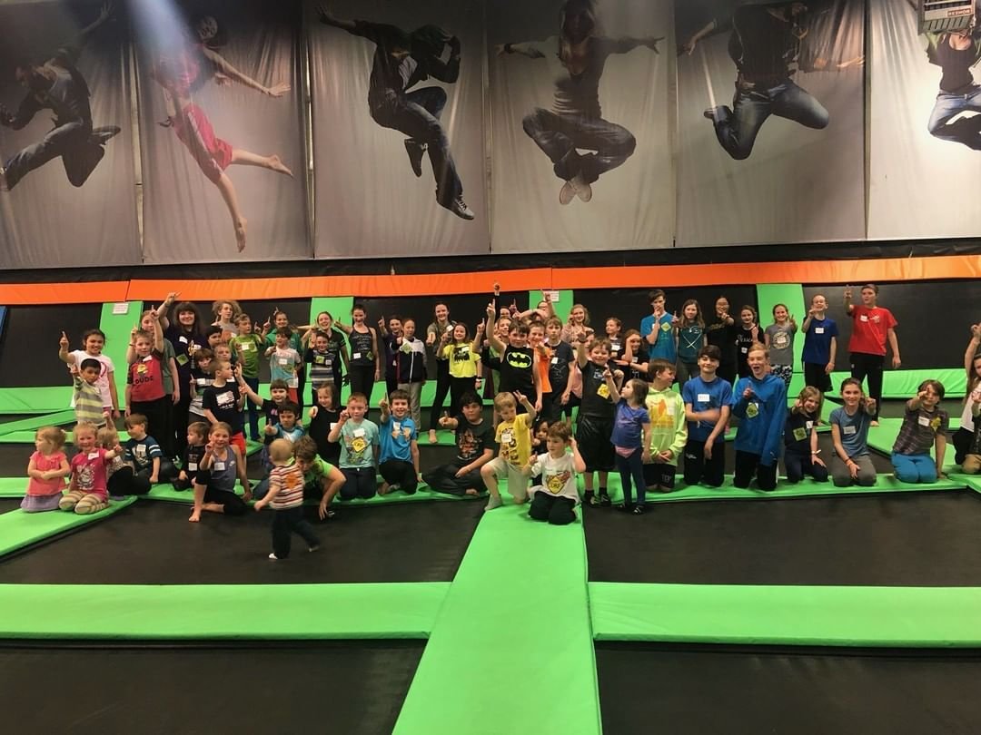 Kids posing for a photo at Elevated Sports Trampoline park in Bothell, Washington.