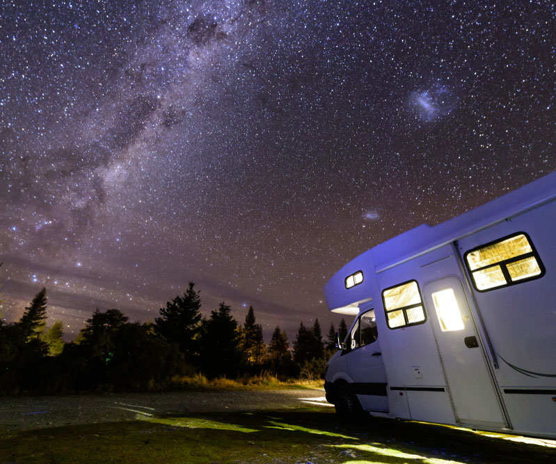 Camper parked under the stars at Lake Pleasant RV Park in Bothell, Washington.