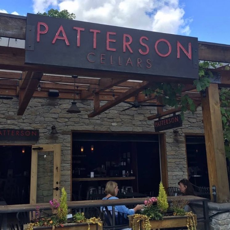 People sitting on the outdoor patio at Patterson Cellars near Bothell, Washington.