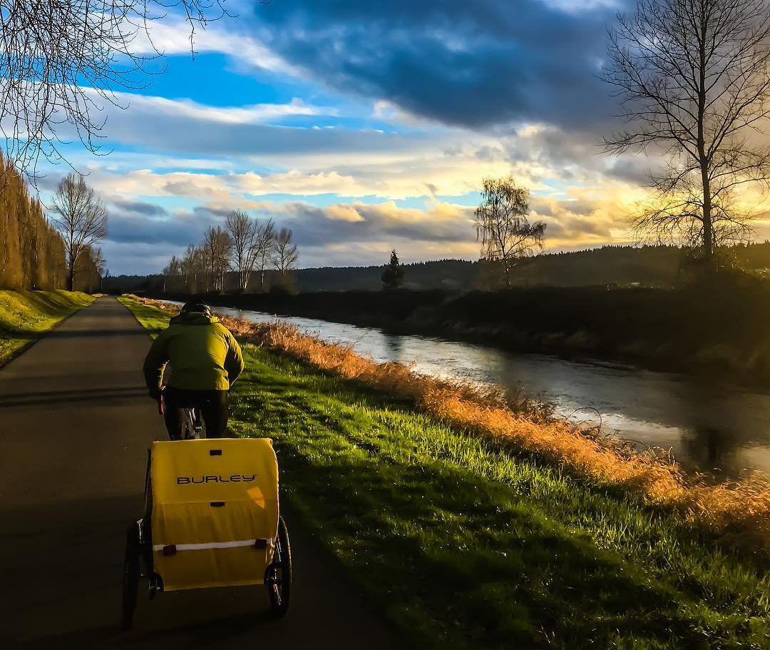 Person riding their bike down the Sammamish River Trail in Bothell, Washington.