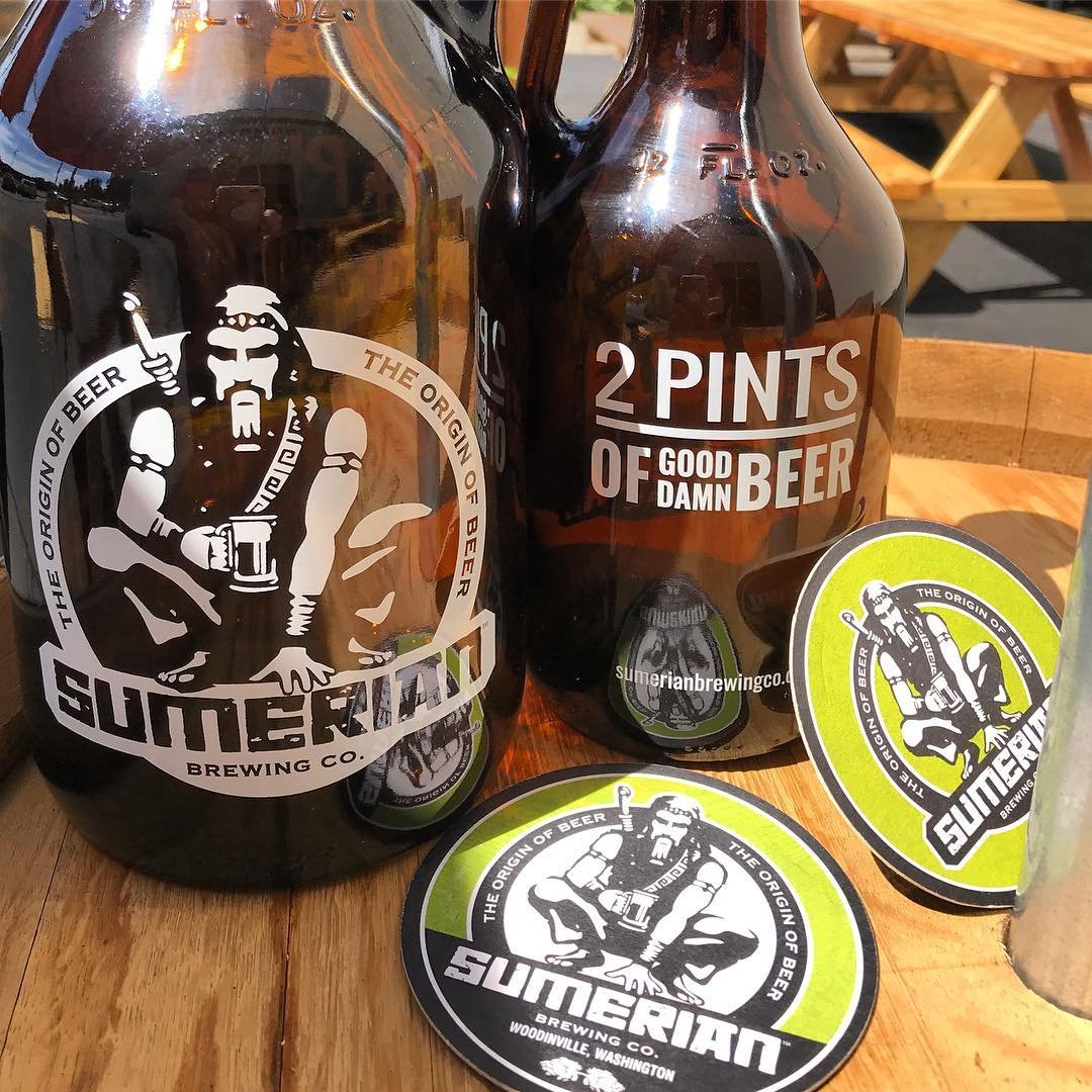 Two large growlers of beer from Sumerian Brewing Co near Bothell, Washington.