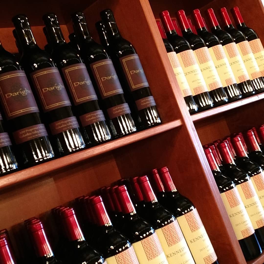 Shelves lined with bottles of wine at The Woodhouse Wine Estates near Bothell.