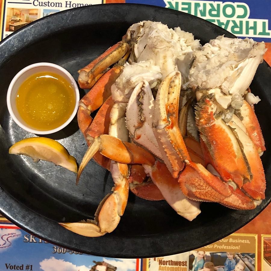 Plate of crab legs and butter from Thrashers Corner Pub & Broiler in Bothell.