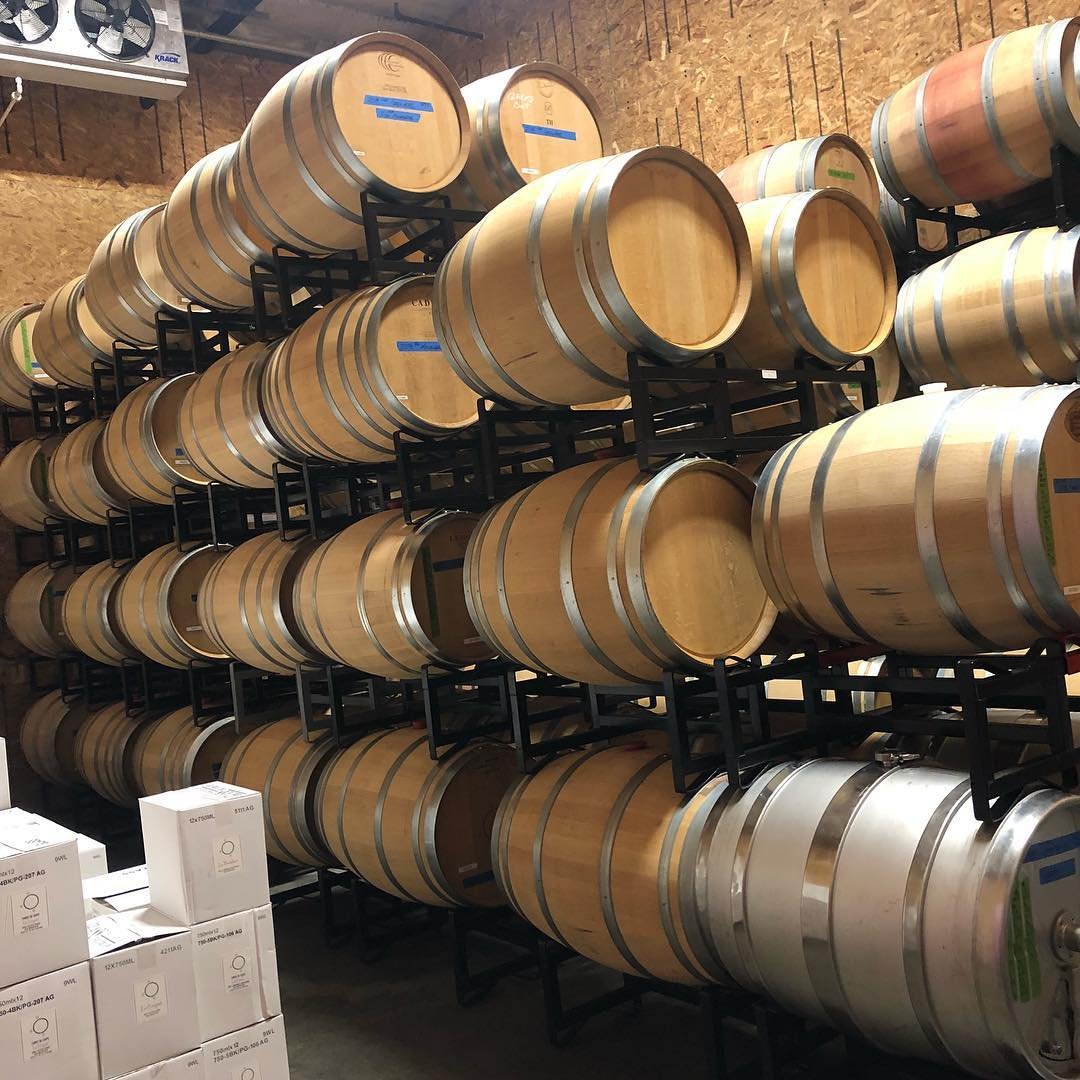 Large barrels of wine stacked up at Three of Cups Winery near Bothell, Washington.
