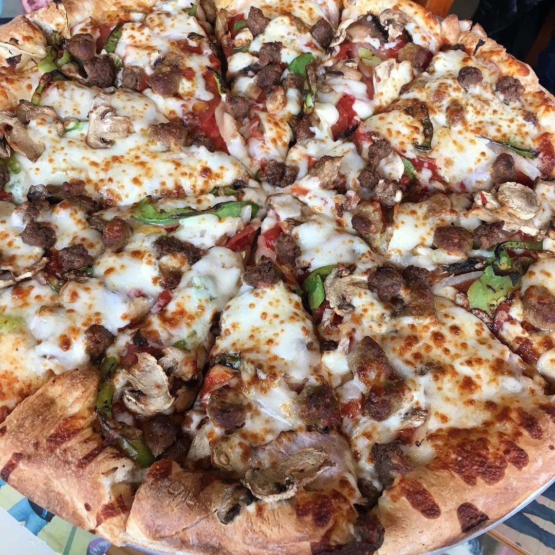 Large meat and veggie pizza from Uncle Peteza's Pizzeria in Bothell, Washington.