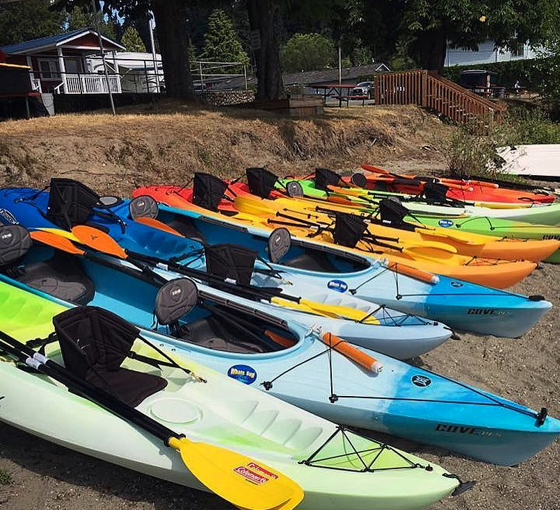 Kayaks lined up ready to go into the Sammamish River in Bothell, Washington.