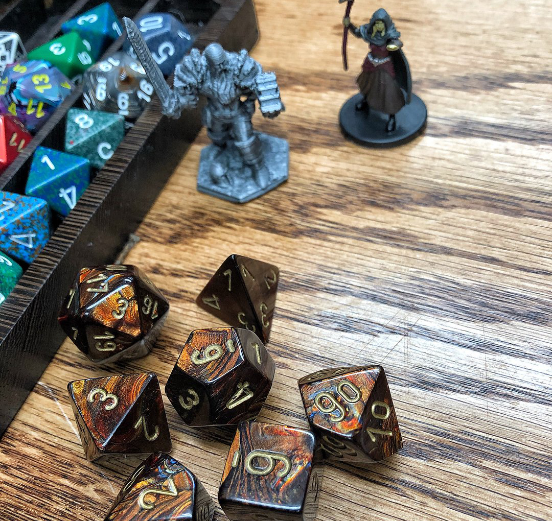 Board game dice and character pieces at Zulu's Board Game Café in Bothell.
